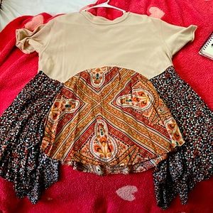 boutique blouse with multicolor designs and patterns on the bottom